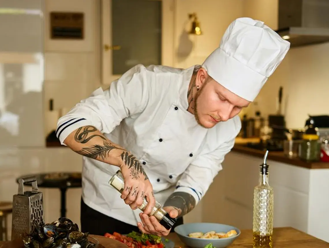 cook is cooking a meal